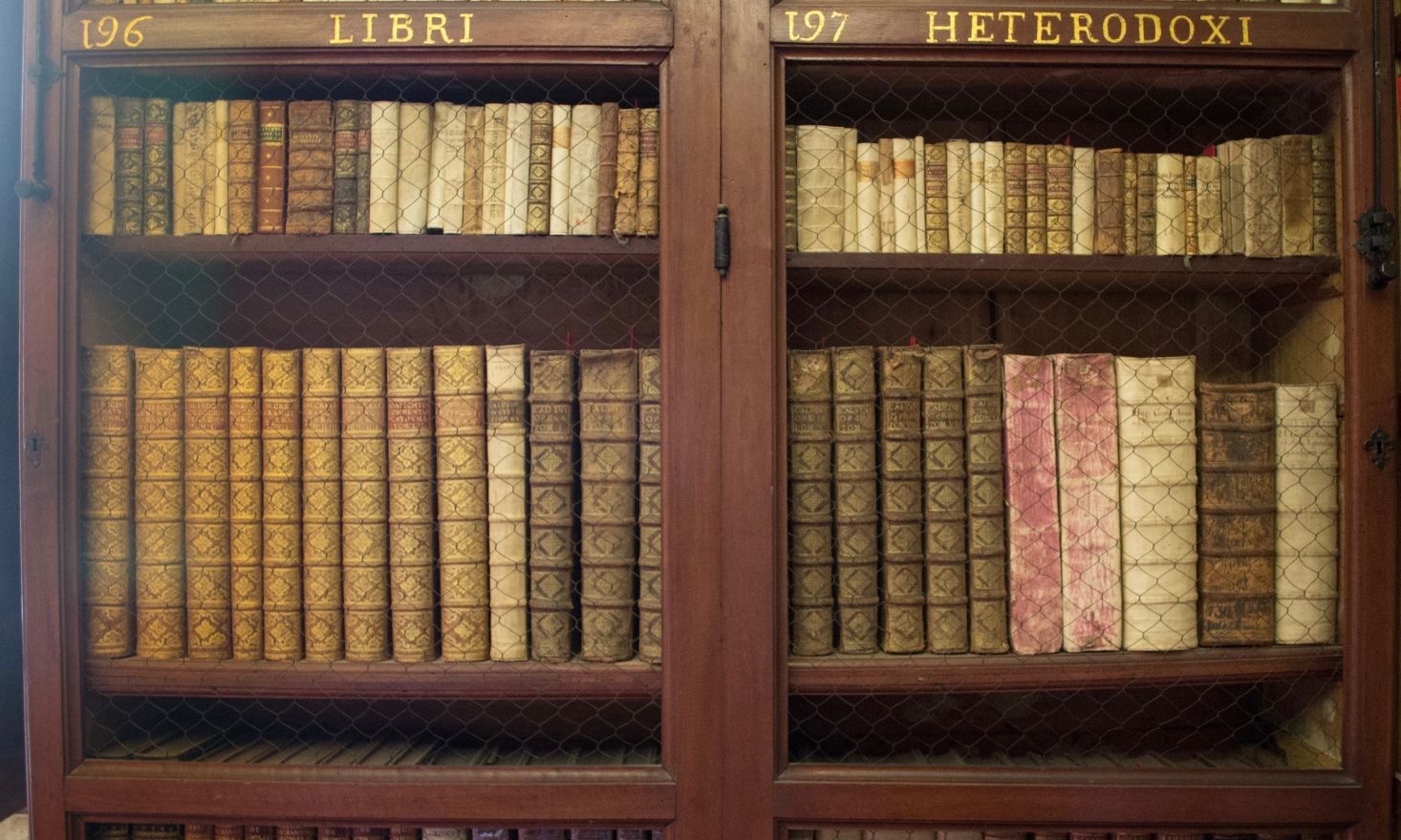 Wooden bookcase with old books.