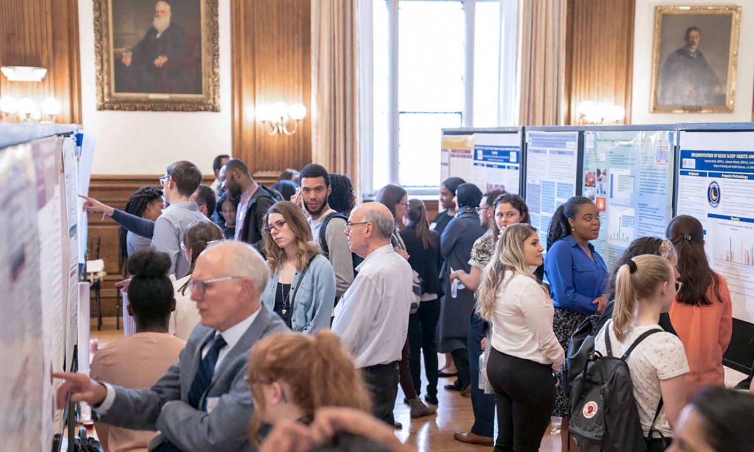People looking at posters