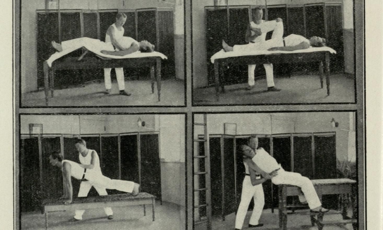 Black and white image of a person helping another person stretch on a table.