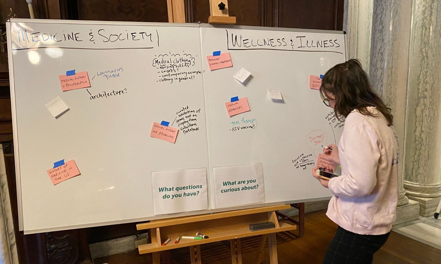 Person writing on a whiteboard